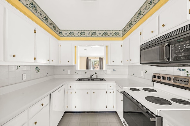 kitchen featuring dishwasher, decorative backsplash, sink, white cabinets, and electric range