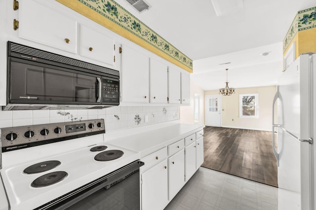 kitchen featuring pendant lighting, tasteful backsplash, white cabinetry, white appliances, and an inviting chandelier