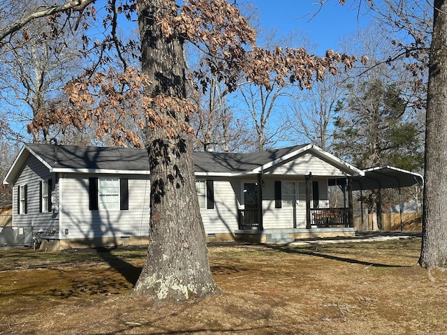 view of front facade featuring a detached carport, crawl space, and covered porch