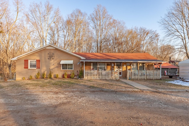 ranch-style house featuring a carport