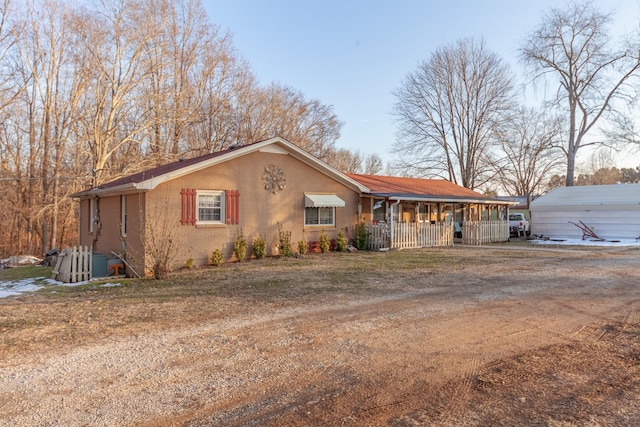 ranch-style home featuring covered porch