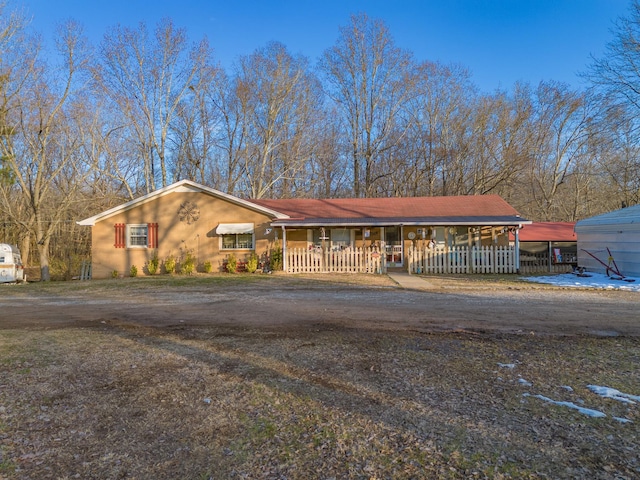 ranch-style home with covered porch