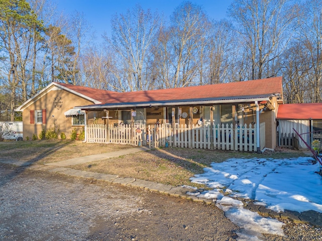 single story home featuring covered porch