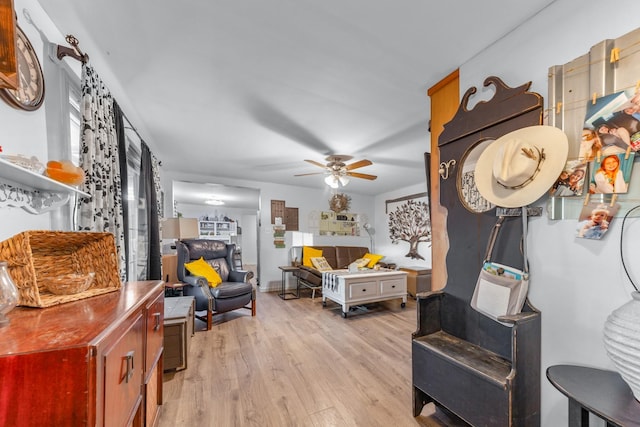 interior space with light wood-type flooring and ceiling fan