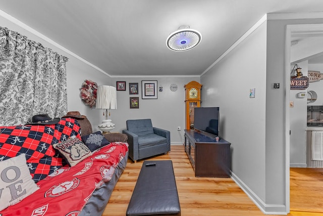 living room with crown molding and wood-type flooring