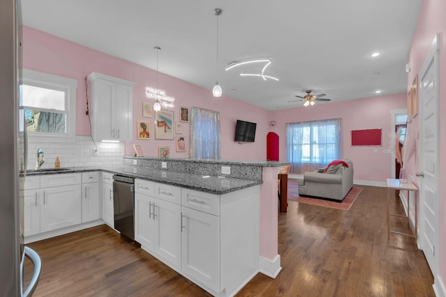 kitchen with ceiling fan, white cabinets, kitchen peninsula, and dishwasher