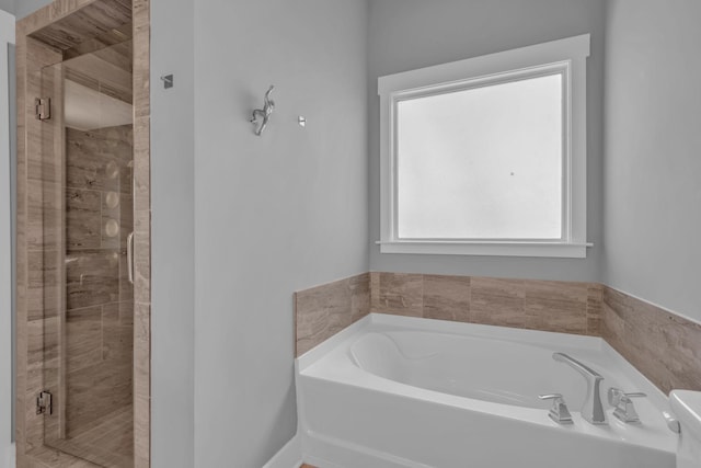 bathroom with separate shower and tub