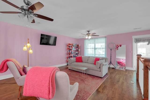 living room featuring plenty of natural light and hardwood / wood-style flooring