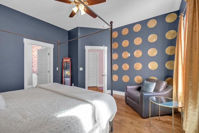 bedroom with ceiling fan and wood-type flooring