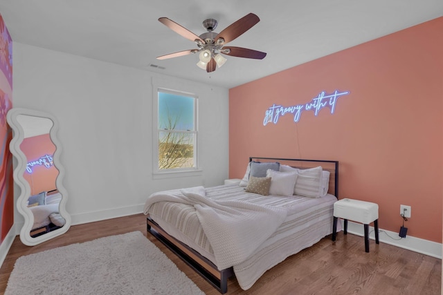 bedroom featuring ceiling fan and hardwood / wood-style floors