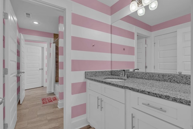 bathroom featuring vanity and shower / tub combo with curtain