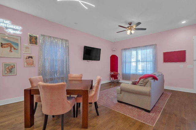 dining room featuring ceiling fan and dark hardwood / wood-style flooring