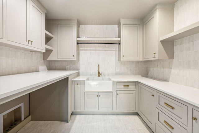 kitchen featuring decorative backsplash and sink