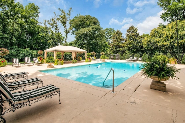 view of swimming pool with a gazebo and a patio