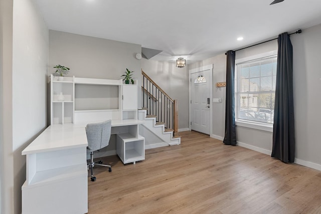 office with light wood-type flooring