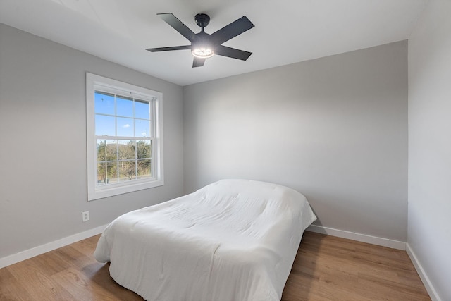 bedroom featuring ceiling fan and light wood-type flooring