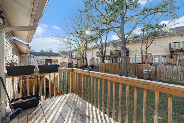 wooden deck with a lawn