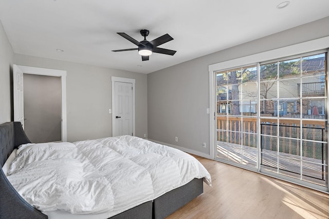 bedroom with ceiling fan, access to exterior, and light hardwood / wood-style floors