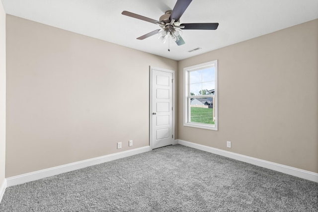 carpeted empty room featuring ceiling fan