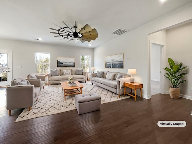 living room with ceiling fan and wood-type flooring