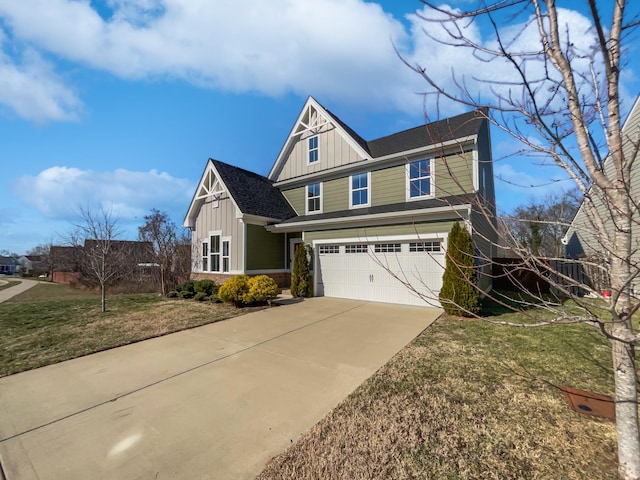 view of front of property featuring a front yard and a garage