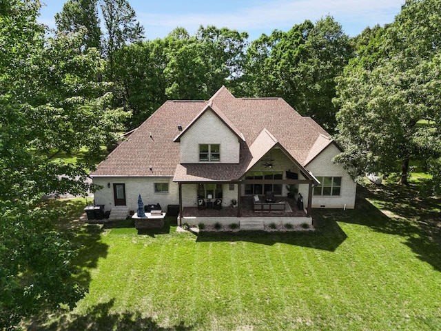 back of house featuring a lawn