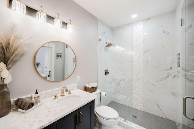 bathroom featuring walk in shower, vanity, and toilet