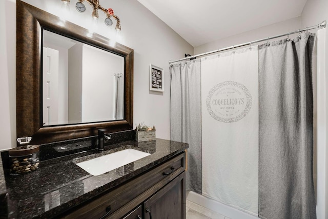 bathroom with vanity and a shower with shower curtain