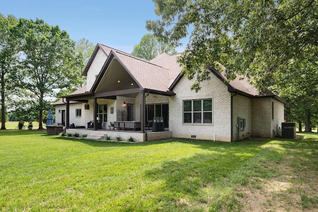 back of house with a patio area, central air condition unit, and a yard