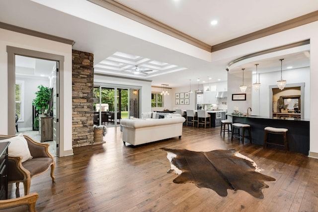 living room featuring ceiling fan, dark hardwood / wood-style floors, and ornamental molding