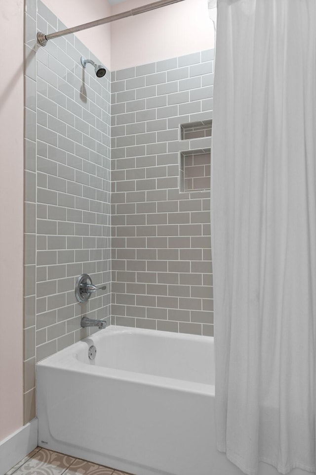 bathroom with shower / bathtub combination with curtain