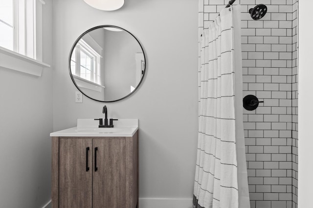 bathroom featuring vanity and a shower with shower curtain