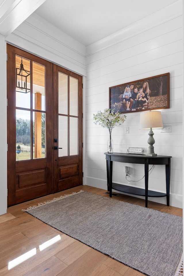 entryway featuring french doors and wood-type flooring