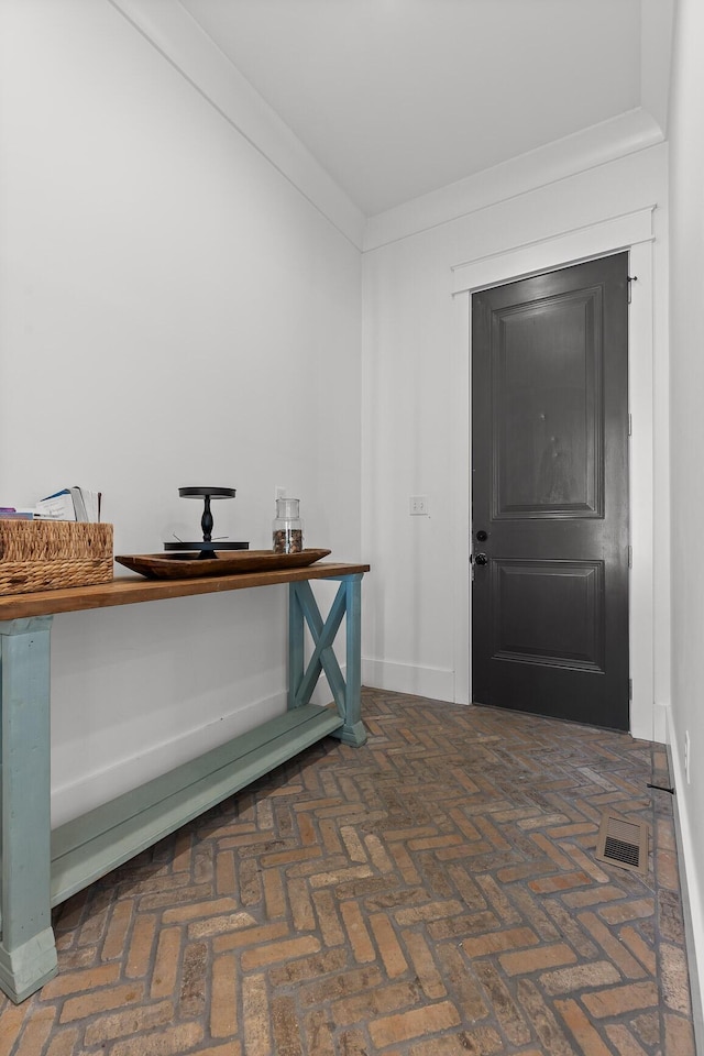 entryway with crown molding