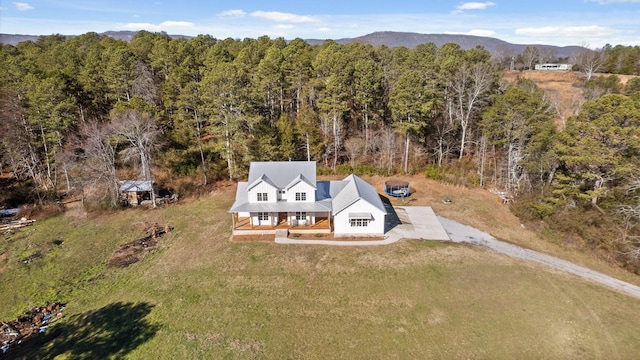 birds eye view of property with a mountain view