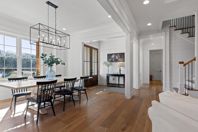 dining room featuring ornamental molding and hardwood / wood-style floors