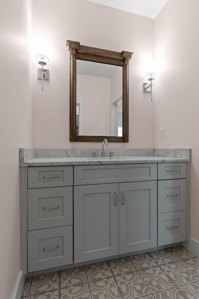 bathroom with tile patterned floors and vanity