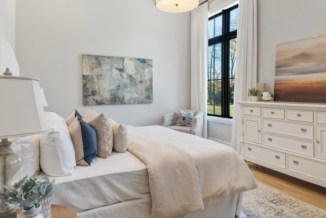 bedroom with light hardwood / wood-style flooring