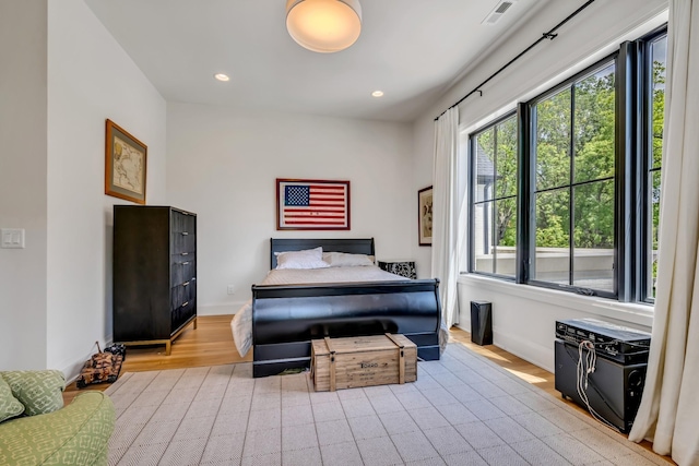 bedroom with light wood-type flooring