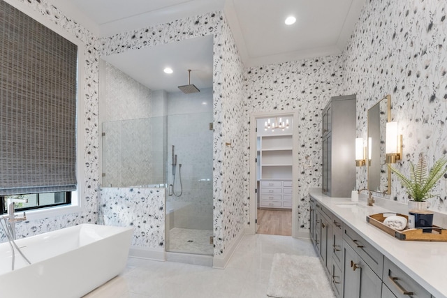 bathroom with tile patterned flooring, vanity, crown molding, and plus walk in shower