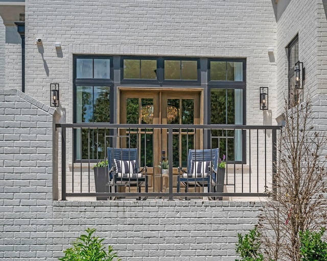 wooden deck with french doors and an outdoor living space