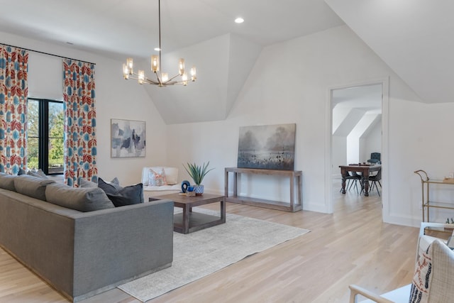 living room with light wood-type flooring, vaulted ceiling, and a chandelier