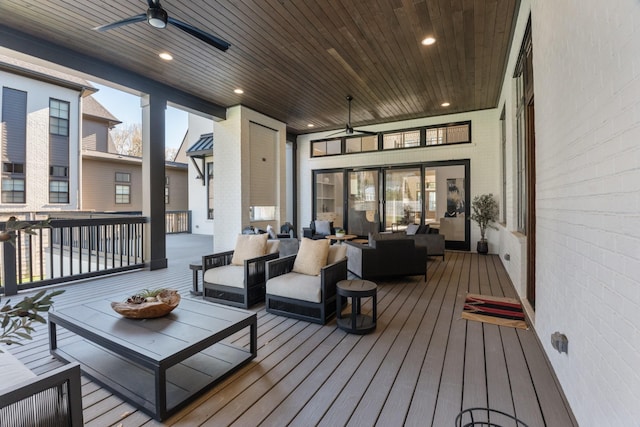 deck featuring ceiling fan and outdoor lounge area