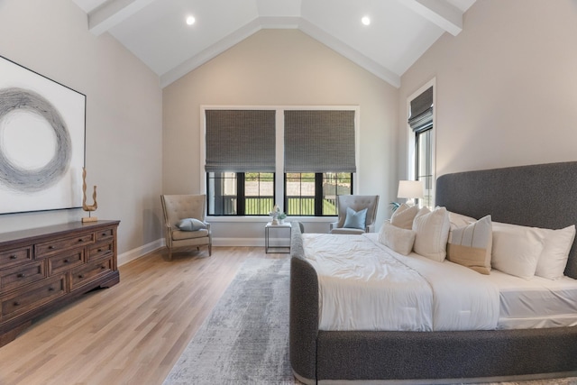 bedroom featuring lofted ceiling and hardwood / wood-style floors