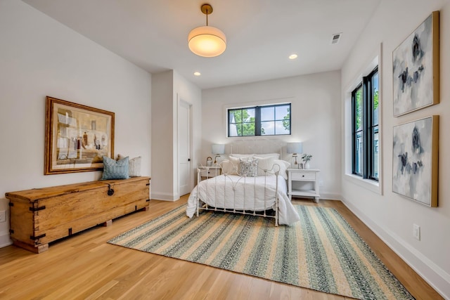 bedroom with hardwood / wood-style floors