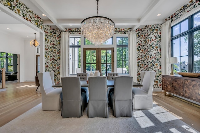 dining space featuring light hardwood / wood-style flooring, beam ceiling, and coffered ceiling