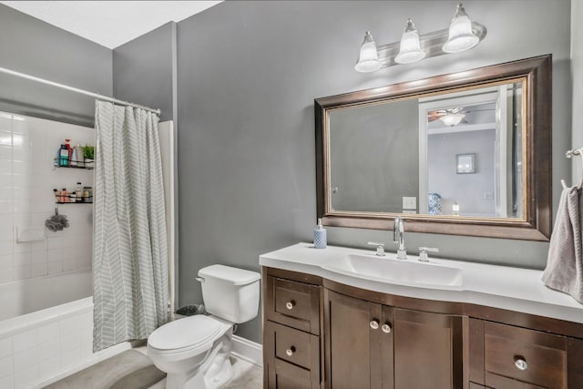 full bathroom featuring ceiling fan, toilet, vanity, and shower / bath combination with curtain