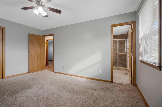 unfurnished bedroom with light carpet, ceiling fan, and ensuite bathroom