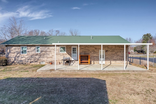 back of property featuring a patio