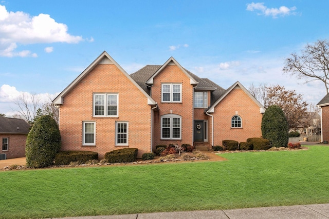 front facade featuring a front yard